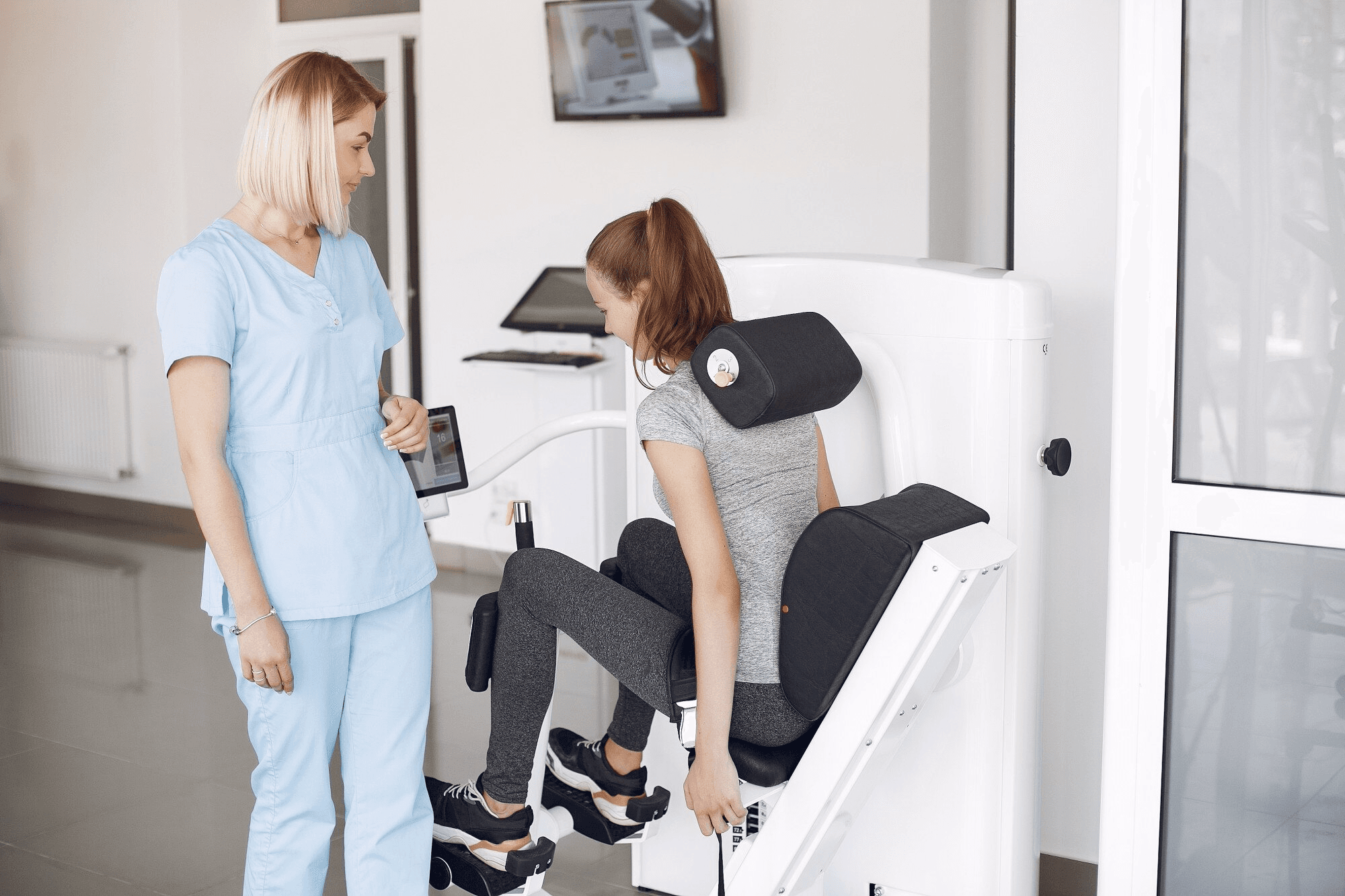 Practitioner assisting a patient in a treatment chair